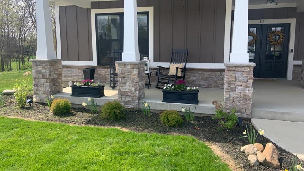 Stone wall on front porch of a house