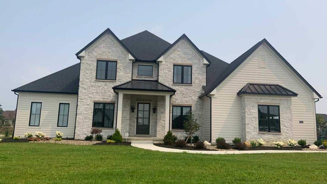 cream-colored-home-with-siding-and-stone-veneer cream colored-home with siding and stone veneer